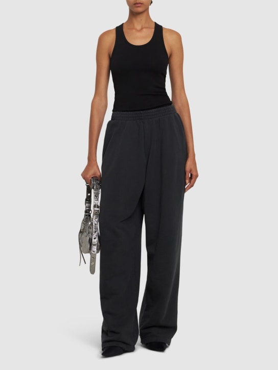 Balenciaga: Pantaloni baggy fit in felpa di cotone - Nero Delave' - women_1 | Luisa Via Roma