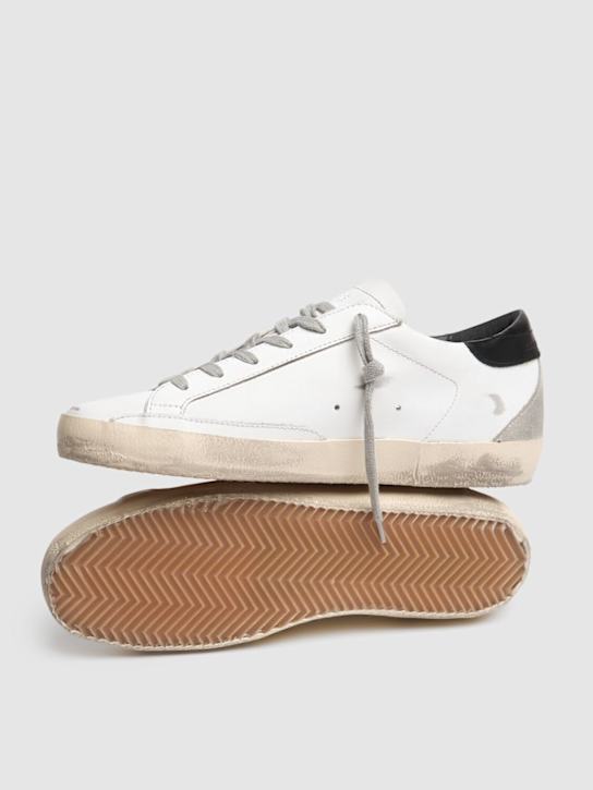 Golden Goose: Sneakers Super-Star in pelle e camoscio 20mm - Bianco/Nero - women_3 | Luisa Via Roma