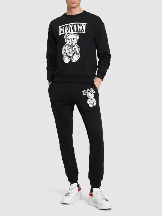 Moschino: Teddy print cotton crewneck sweatshirt - Black/White - men_1 | Luisa Via Roma