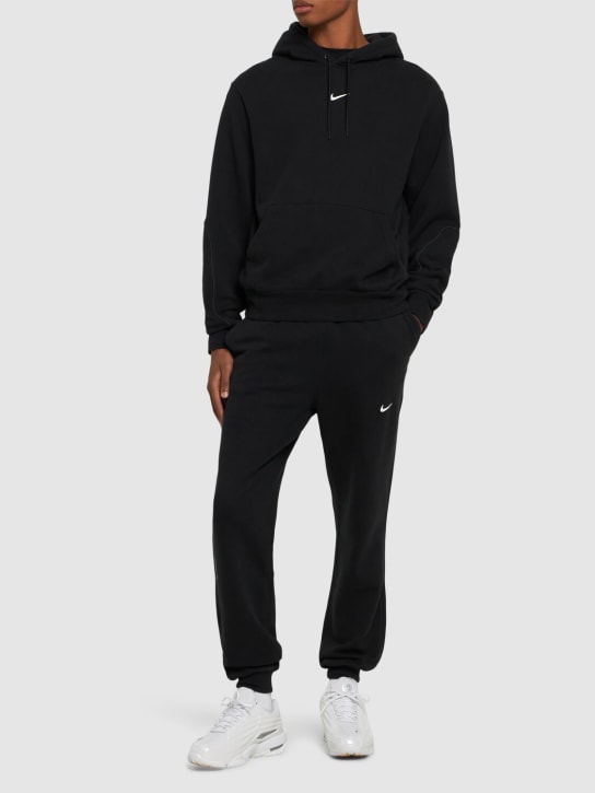 Nike: Pantalon en polaire Nocta Cardinal - Noir - men_1 | Luisa Via Roma