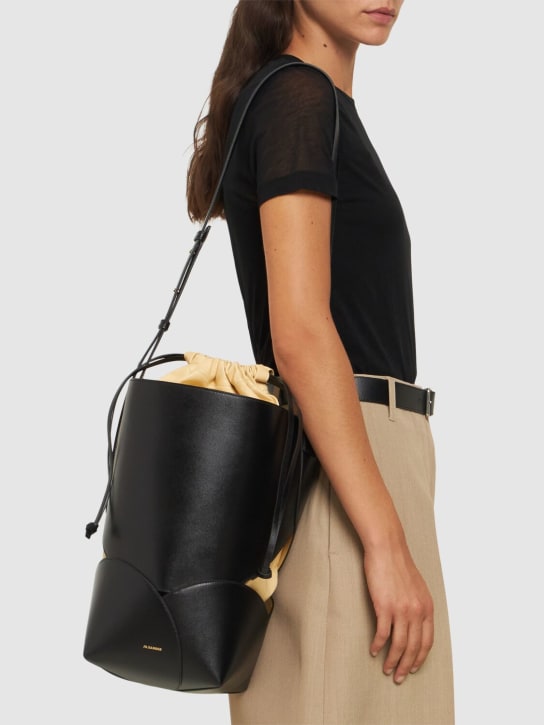 Jil Sander: Medium Ellipse leather bucket bag - Black - women_1 | Luisa Via Roma