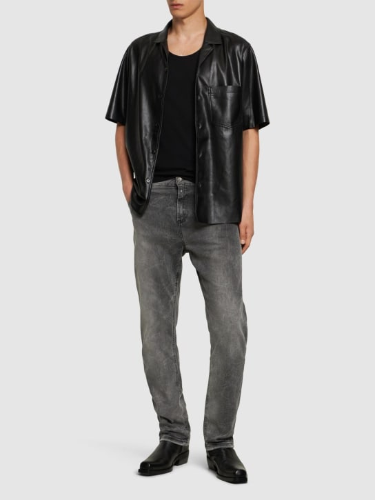 Balmain: Regular fit washed denim jeans - men_1 | Luisa Via Roma