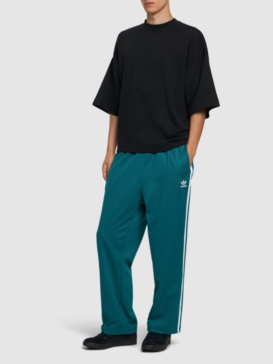 adidas Originals: Baggy track pants - Petrol - men_1 | Luisa Via Roma