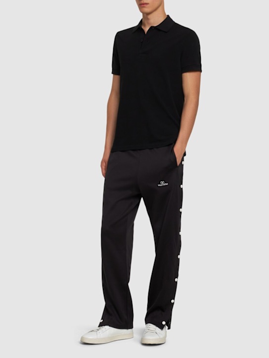 Valentino: Jogginghose aus Baumwollmischung mit Logo - Schwarz/Weiß - men_1 | Luisa Via Roma