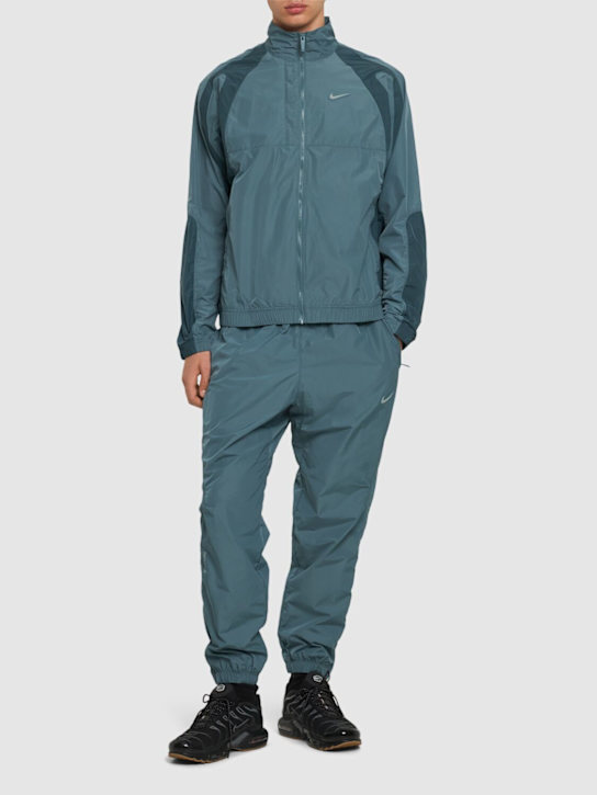 Nike: Nocta Cardinal track jacket - Mineral Slate - men_1 | Luisa Via Roma