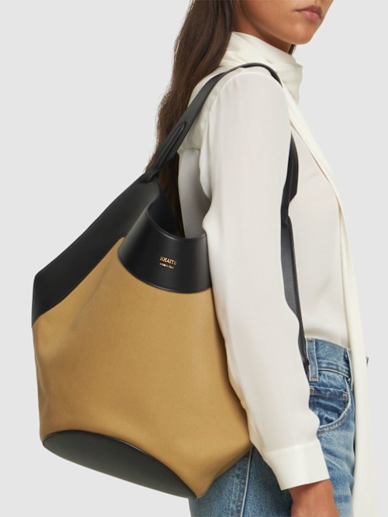 Khaite: Medium Lotus canvas & leather tote bag - Black/Honey - women_1 | Luisa Via Roma