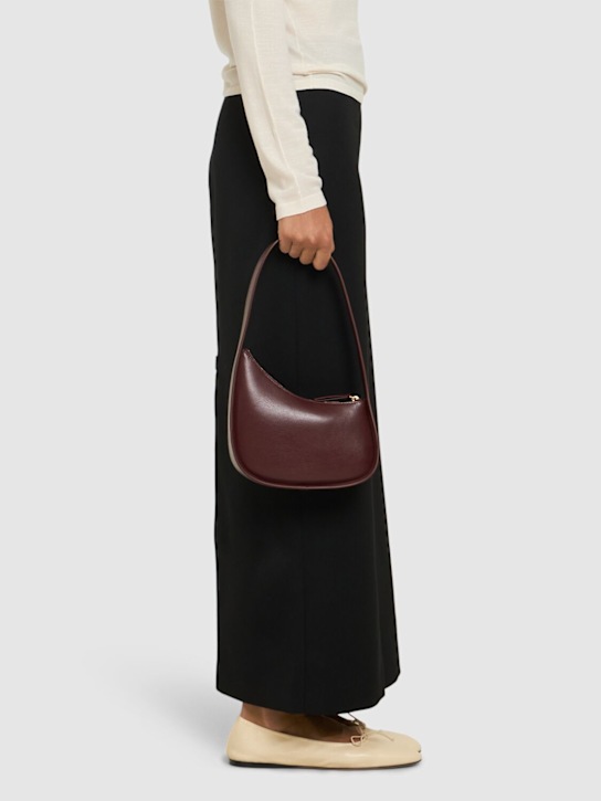 The Row: Half Moon shiny leather shoulder bag - women_1 | Luisa Via Roma