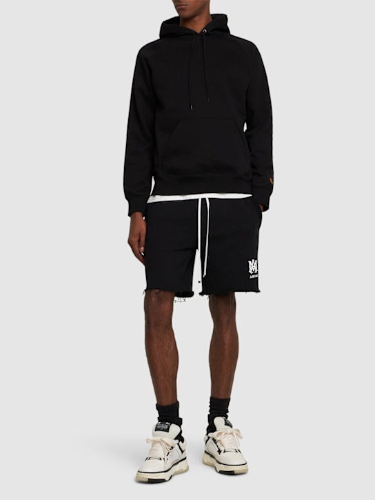 Amiri: Shorts in jersey di cotone con stampa - Nero - men_1 | Luisa Via Roma