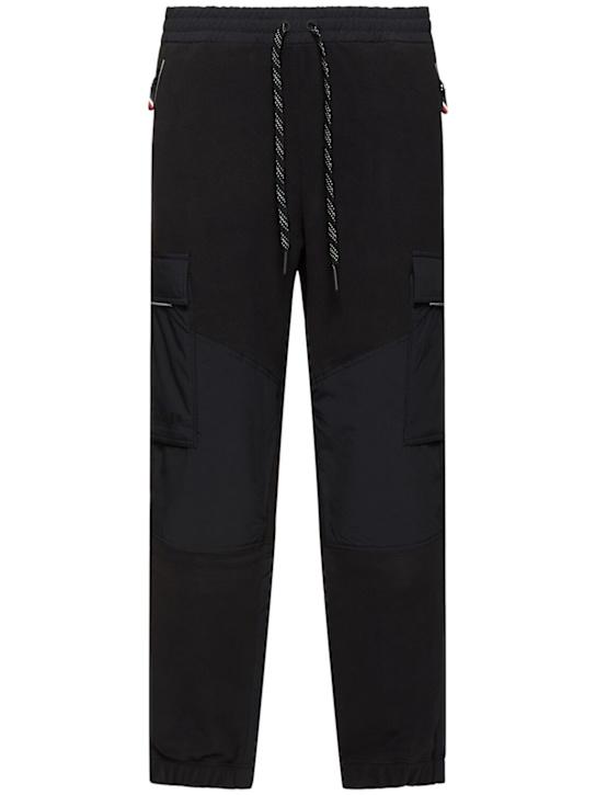 Moncler Grenoble: Polartec tech sweatpants - men_0 | Luisa Via Roma