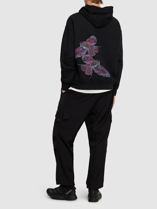 Y-3: Sweat-shirt en coton mélangé à capuche GFX - men_1 | Luisa Via Roma