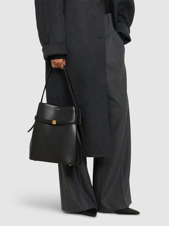 Toteme: Belted palmellata leather bucket bag - Black - women_1 | Luisa Via Roma