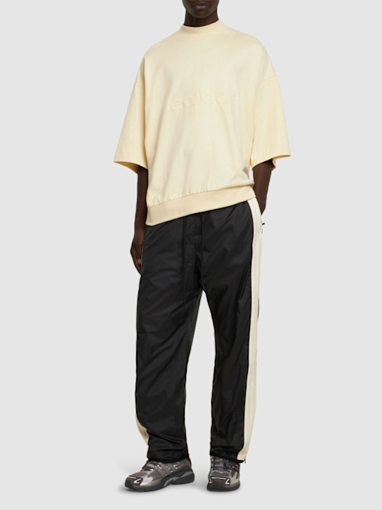 adidas Originals: Fear Of God woven relaxed track pants - men_1 | Luisa Via Roma