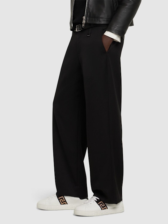 Versace: Studded low top sneakers - men_1 | Luisa Via Roma