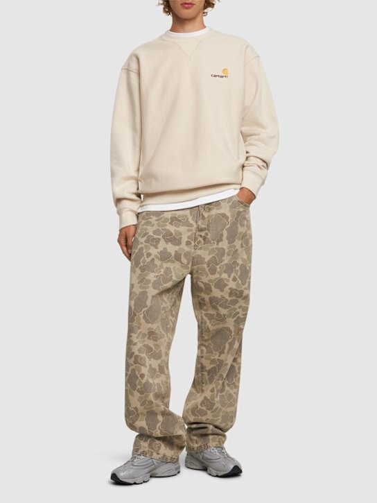 Carhartt WIP: Duck Landon camo denim jeans - men_1 | Luisa Via Roma