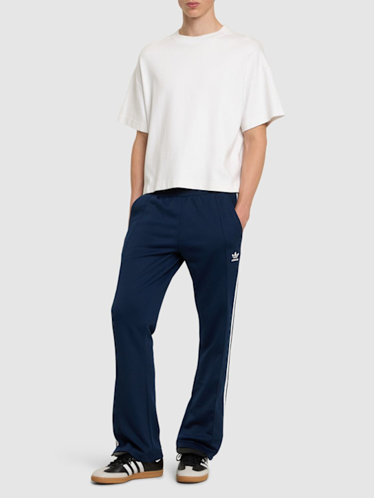 adidas Originals: Adicolor 70s track pants - men_1 | Luisa Via Roma