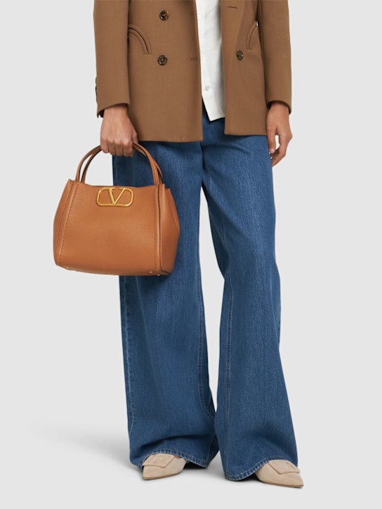 Valentino Garavani: Medium grained leather top handle bag - women_1 | Luisa Via Roma