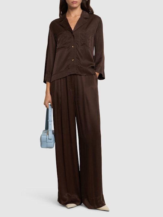 GANNI: Washed satin high waist flared leg pants - women_1 | Luisa Via Roma