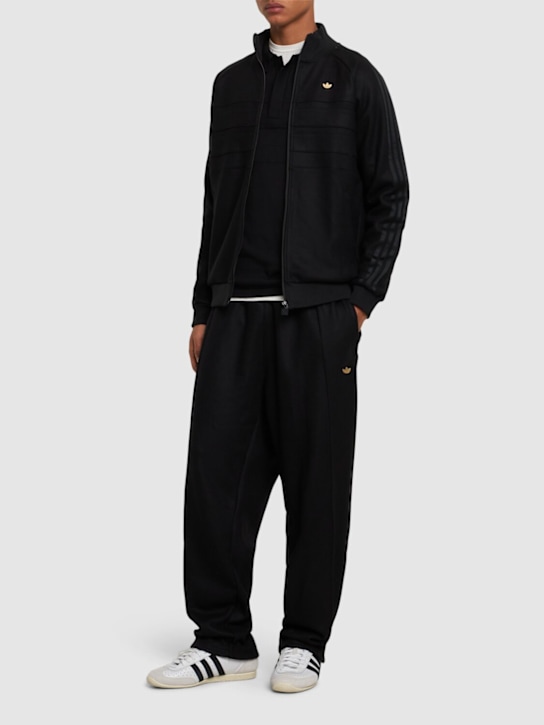 adidas Originals: Wool blend track pants - men_1 | Luisa Via Roma