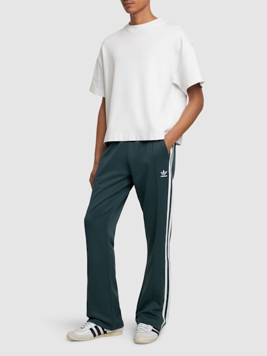 adidas Originals: Adicolor 70s track pants - men_1 | Luisa Via Roma