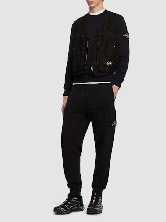 Stone Island: Cotton logo patch sweatpants - men_1 | Luisa Via Roma
