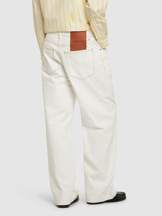 Jacquemus: Le de nîmes large cotton denim jeans - Off-white/Tabac - men_2 | Luisa Via Roma