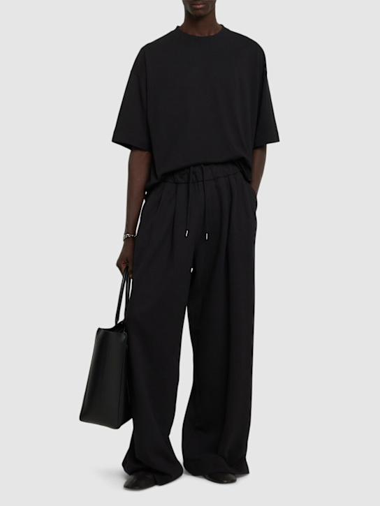Dries Van Noten: Hama pleated wide pants - Black - men_1 | Luisa Via Roma