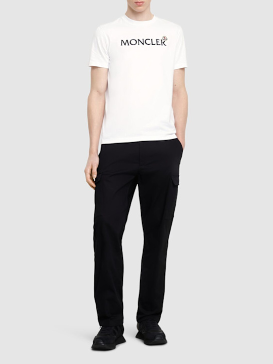 Moncler: Flocked logo cotton t-shirt - White - men_1 | Luisa Via Roma