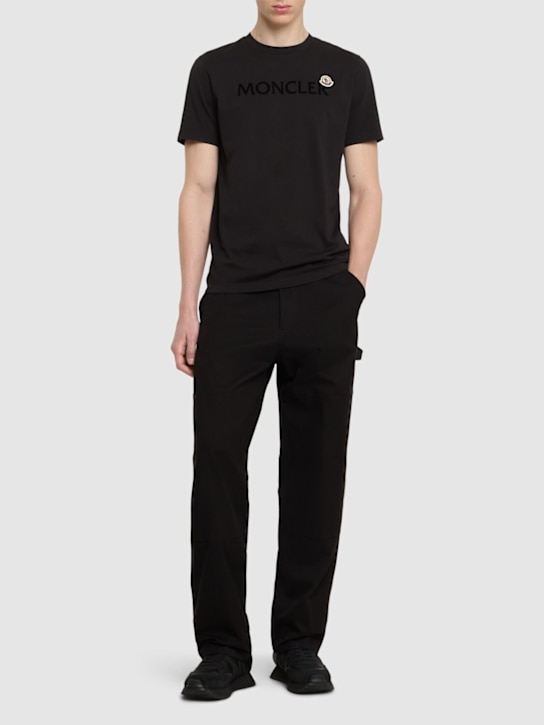 Moncler: Flocked logo cotton t-shirt - Siyah - men_1 | Luisa Via Roma