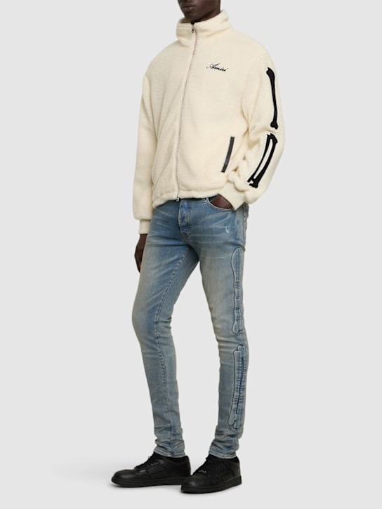 Amiri: 3D Bones紧身弹力牛仔裤 - Clay Indigo - men_1 | Luisa Via Roma