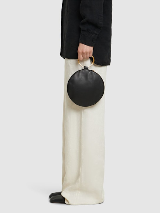 The Row: Round bracelet matte nappa clutch - Black - women_1 | Luisa Via Roma