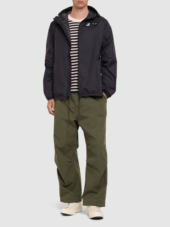 Comme des Garçons Play: K-Way black heart zip jacket - men_1 | Luisa Via Roma