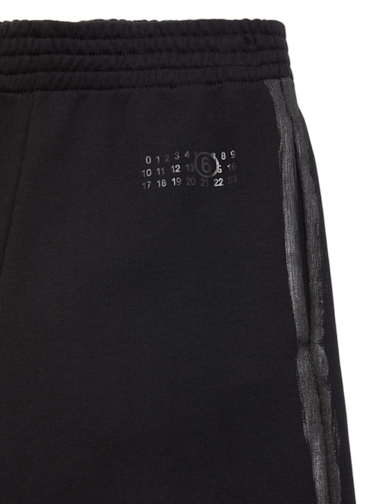 MM6 Maison Margiela: Printed cotton sweatpants - ブラック - kids-boys_1 | Luisa Via Roma