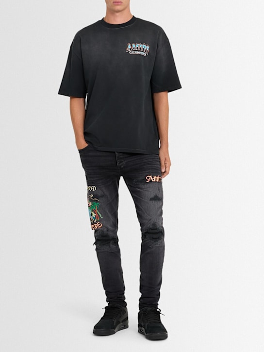 Amiri: Sinners embroidered skinny jeans - Washed Black - men_1 | Luisa Via Roma