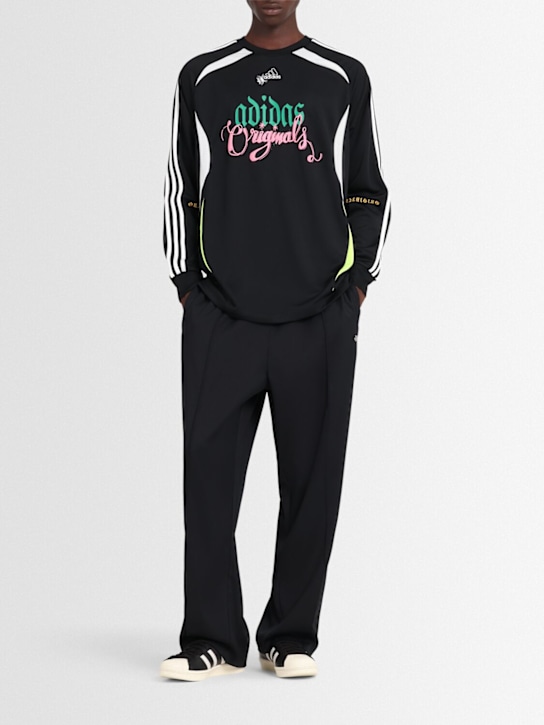 adidas Originals: Baggy track pants - Black - men_1 | Luisa Via Roma