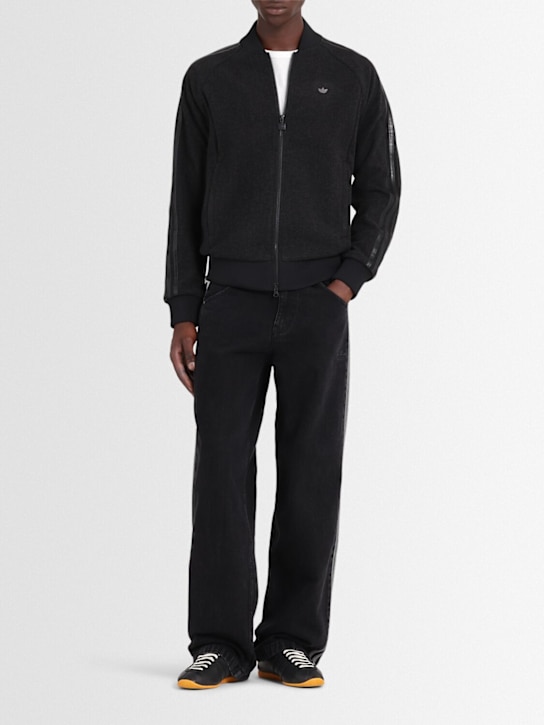 adidas Originals: Firebird denim pants - True Black - men_1 | Luisa Via Roma