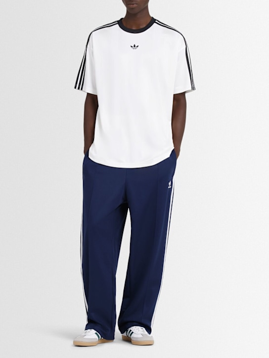 adidas Originals: Baggy track pants - men_1 | Luisa Via Roma