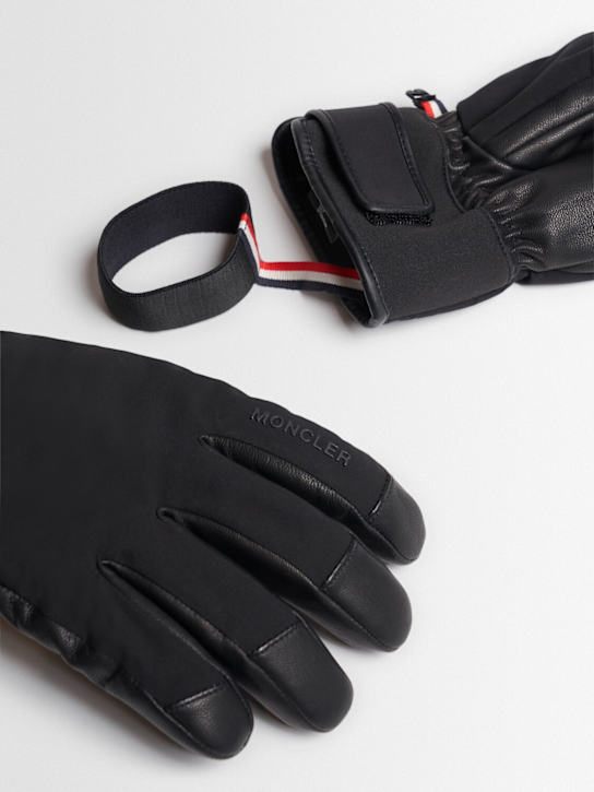 Moncler Grenoble: Padded tech soft shell ski gloves - men_1 | Luisa Via Roma