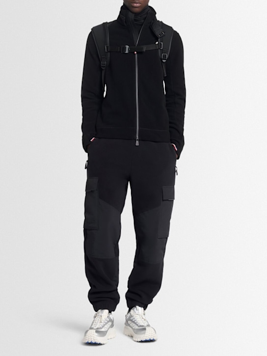 Moncler Grenoble: Padded polartec tech sweatpants - men_1 | Luisa Via Roma