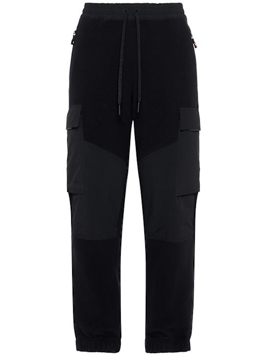 Moncler Grenoble: Padded polartec tech sweatpants - men_0 | Luisa Via Roma