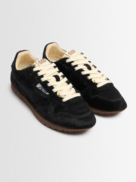 Autry: Windspin low pony skin sneakers - Black - women_1 | Luisa Via Roma