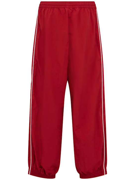 Willy Chavarria: Bad Boy track pants - Red - men_1 | Luisa Via Roma