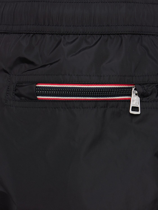 Moncler: Logo patch nylon swim shorts - Black - men_1 | Luisa Via Roma