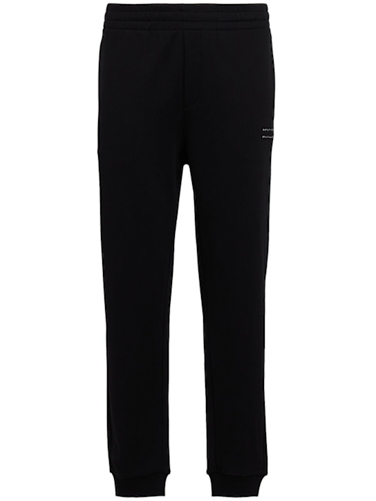 Moncler: Logo cotton fleece track pants - Black - men_0 | Luisa Via Roma