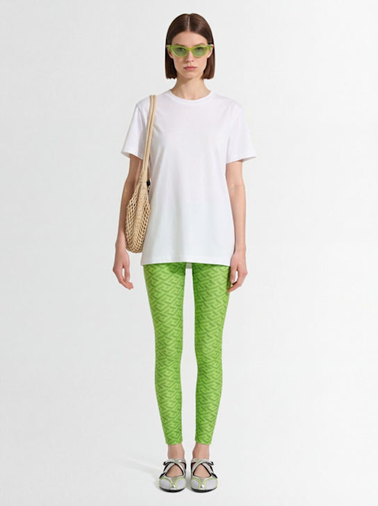 Versace: Legging en jersey imprimé logo - Vert Acide - women_1 | Luisa Via Roma