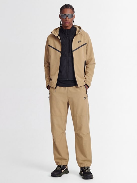 Nike: Tech pants - Parachute Beige - men_1 | Luisa Via Roma