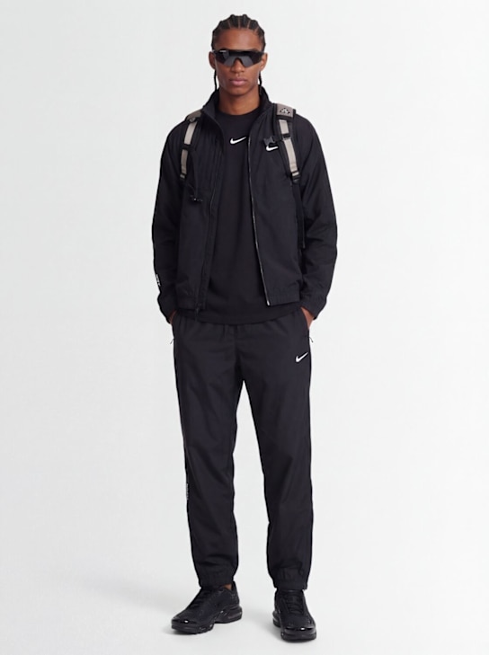 Nike: Nocta track pants - Black - men_1 | Luisa Via Roma