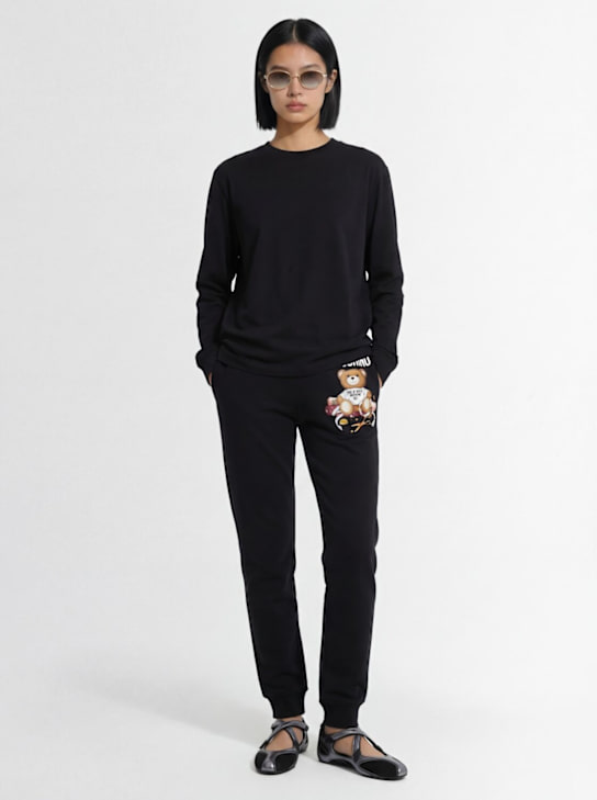 Moschino: Trainingshose aus Baumwolle mit Logo - Schwarz - women_1 | Luisa Via Roma