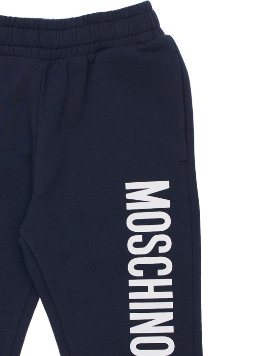 Moschino: Pantalon de jogging en coton imprimé logo - Bleu Marine - kids-girls_1 | Luisa Via Roma