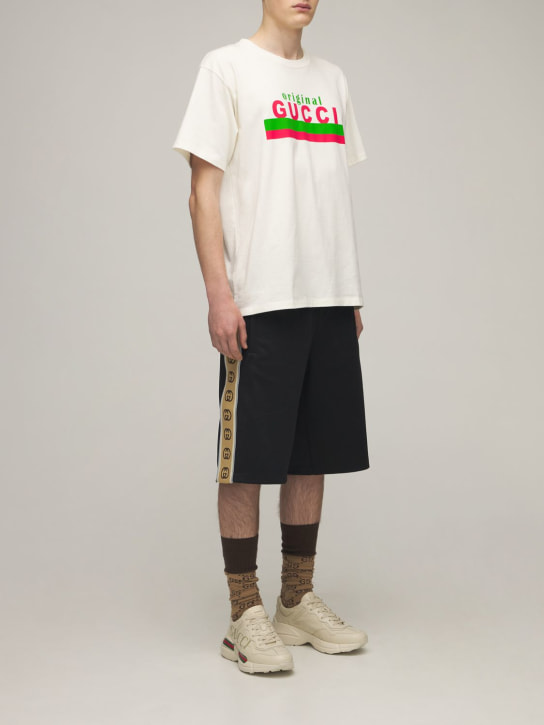 Gucci: Technical jersey shorts w/ side bands - Black - men_1 | Luisa Via Roma
