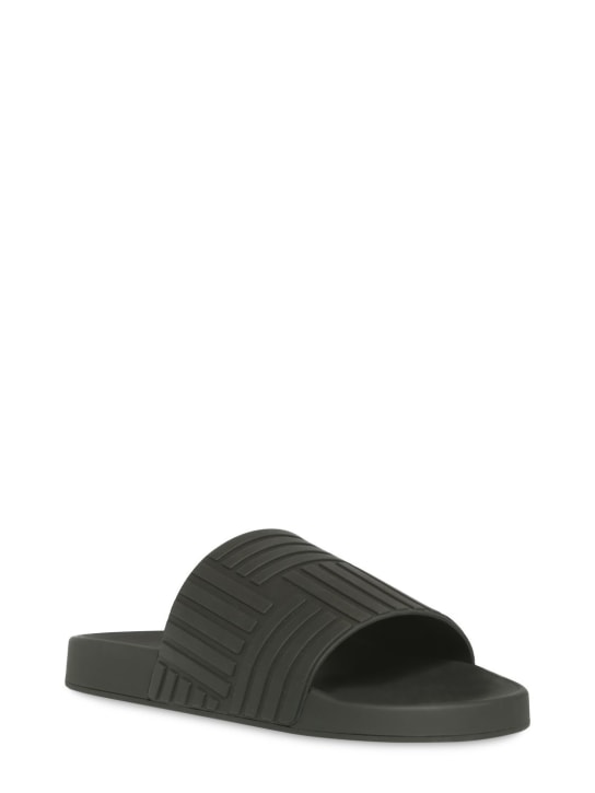 Bottega Veneta: Rubber slide sandals - Black - men_1 | Luisa Via Roma
